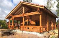 Фото Срубы домов и бань из бревна ручной рубки от компании Изба