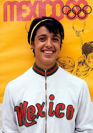 Первой из женщин чашу олимпийского огня зажгла мексиканская бегунья. Фото 2 