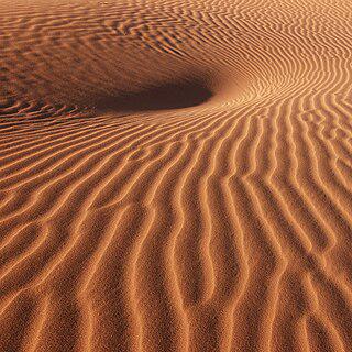 В сочинении «Псаммит» Архимед пытался подсчитать, сколько песчинок занимают в своём объёме Вселенную. Фото 1 